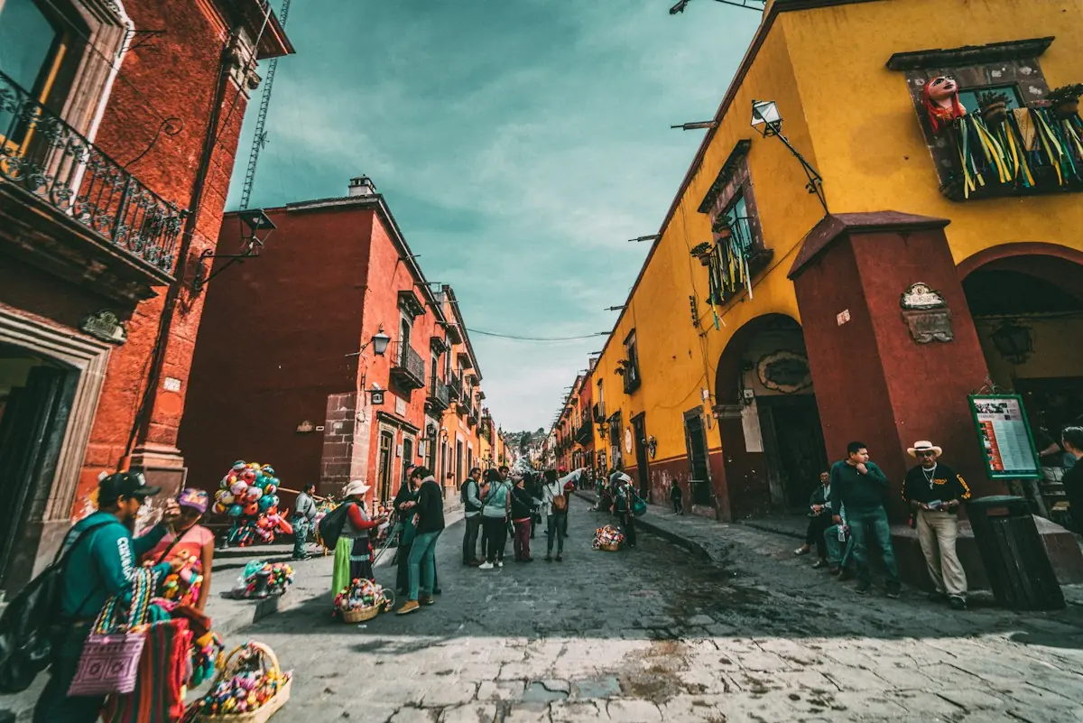 Colorful Mexican town with cathedral and mountains in background
